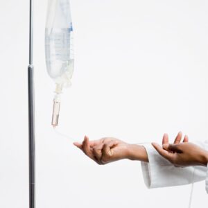 person setting up iv