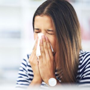 woman sneezing