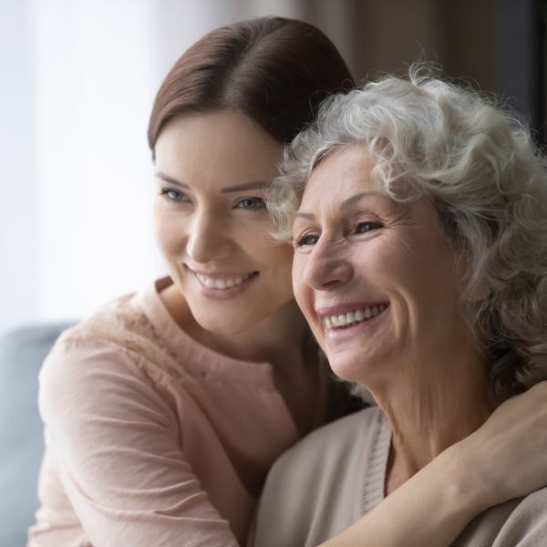 A young and older women hugging