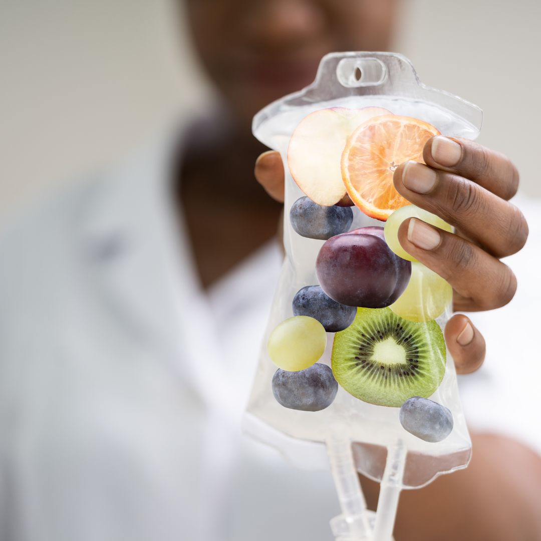 a nurse holding an IV full of fruit