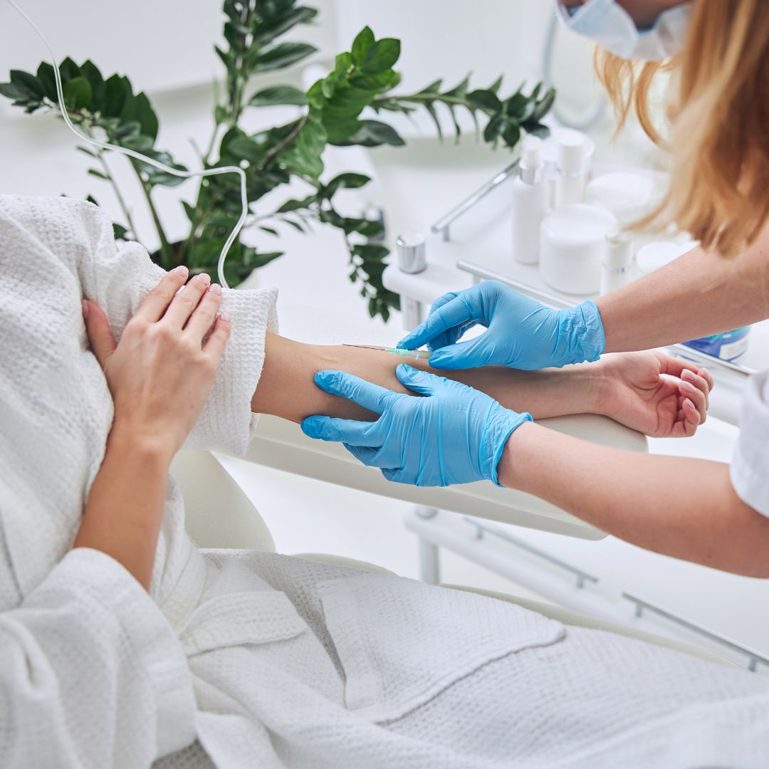 a nurse inserting an IV