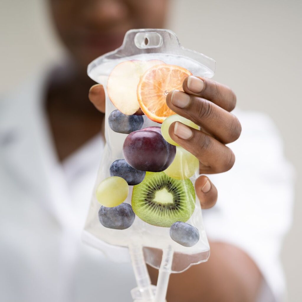 close up of nurse holding IV bag with fruit in it