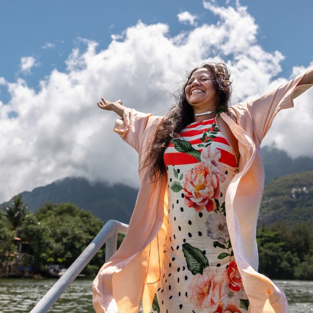 Woman standing on a boat in a lake