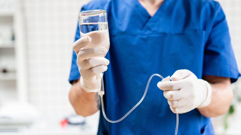 Person holding an IV bag