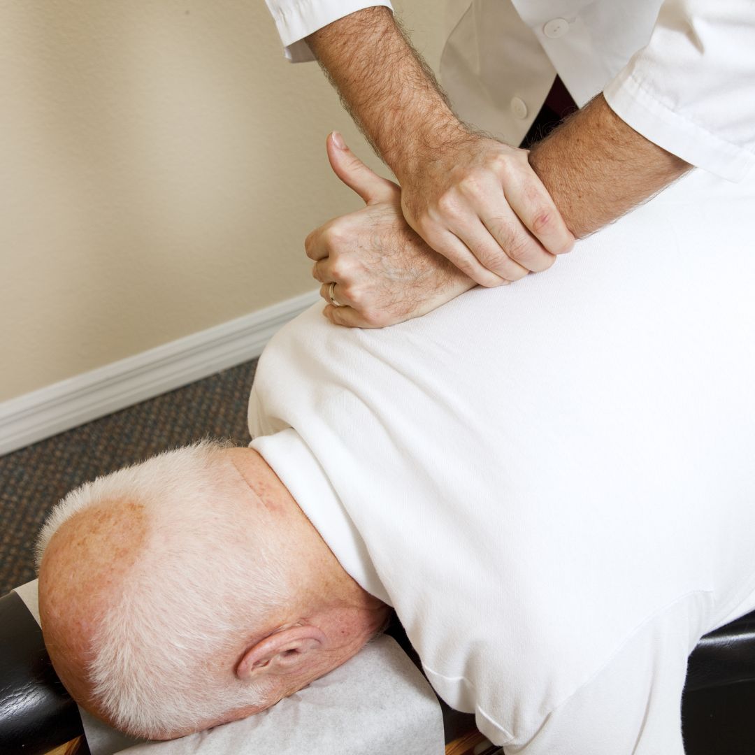 Man receiving chiropractic care