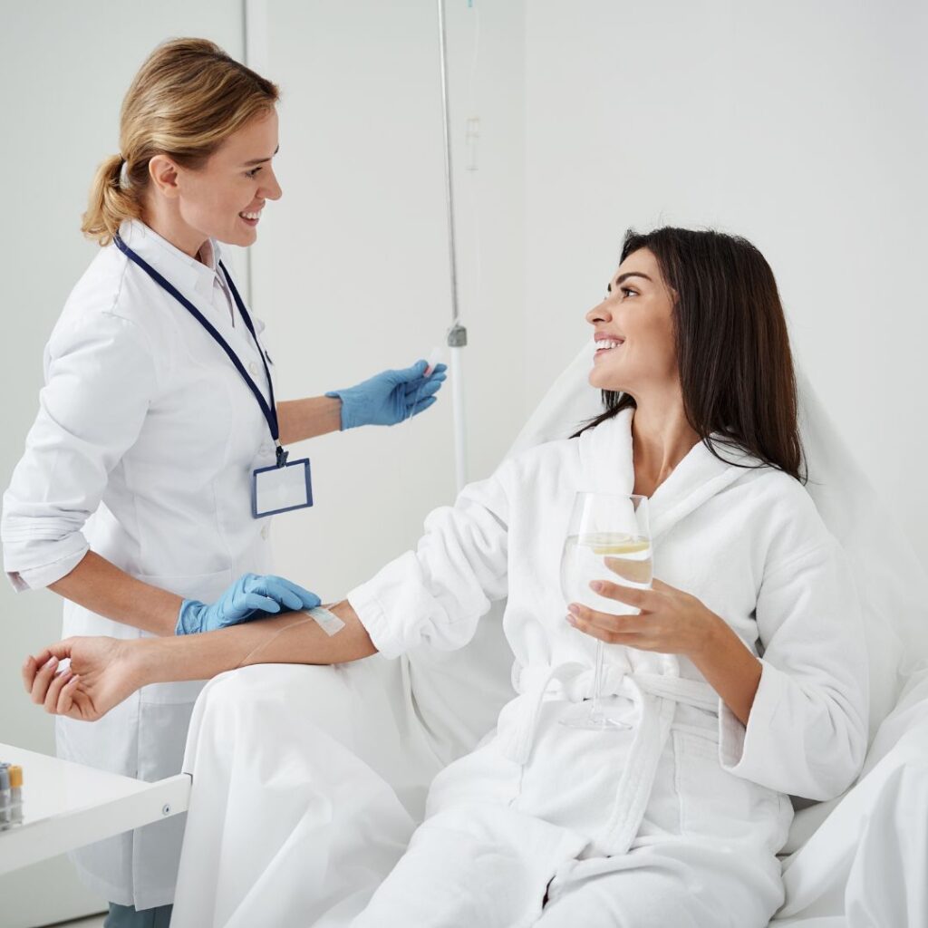 a woman receiving IV therapy