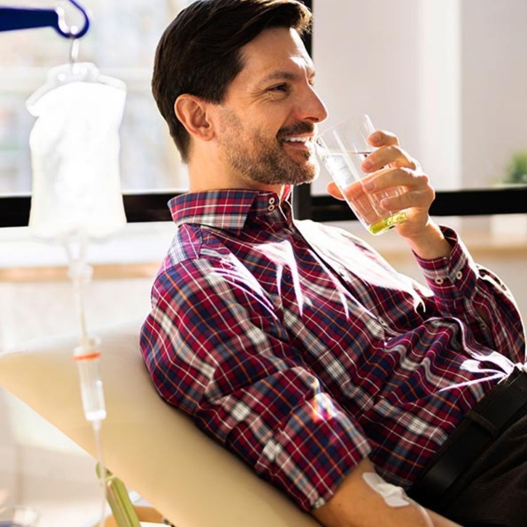 man calming experiencing IV therapy